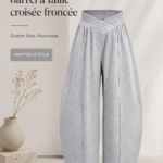 Femme moderne portant un pantalon à taille froncée lors d'une sortie en ville.