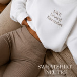Sweatshirt NKE en couleur neutre, idéal pour un look décontracté et stylé.