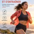 Femme courant dans un parc en portant des vêtements de sport stylés